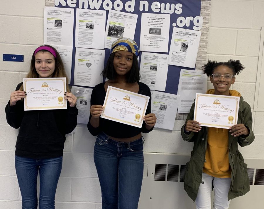 Three journalism students showcasing their announcement for their upcoming short story in a book anthology. 