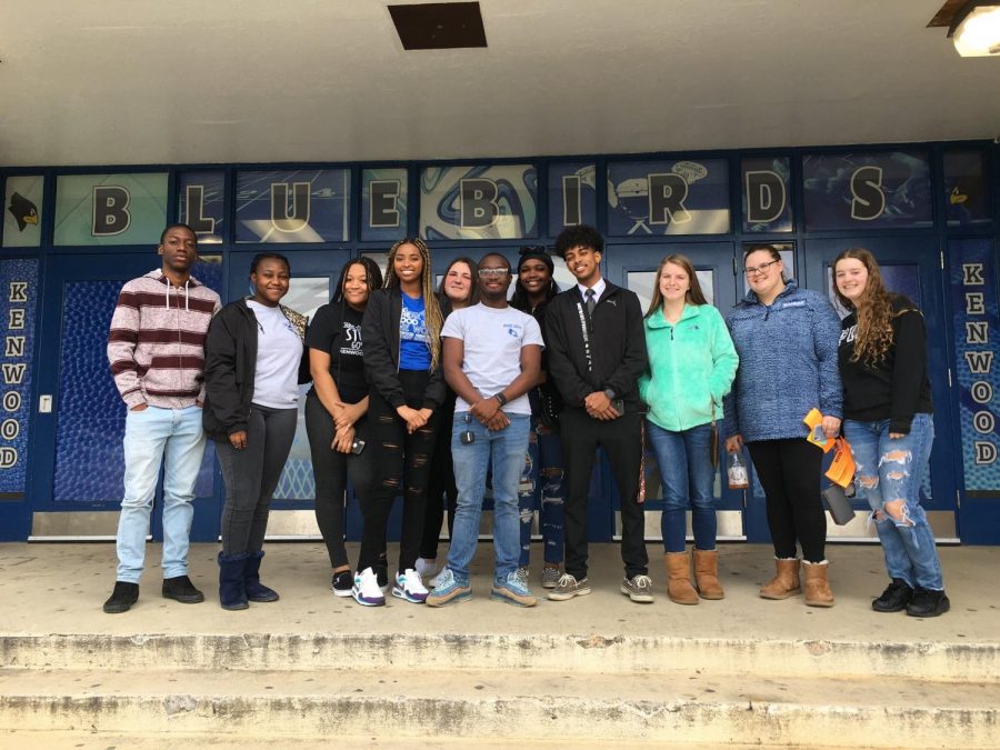 SGA members meeting with SMOB Omer Rashid on February 19, 2020 in front of the new gym doors Kenwood graphic students designed. 