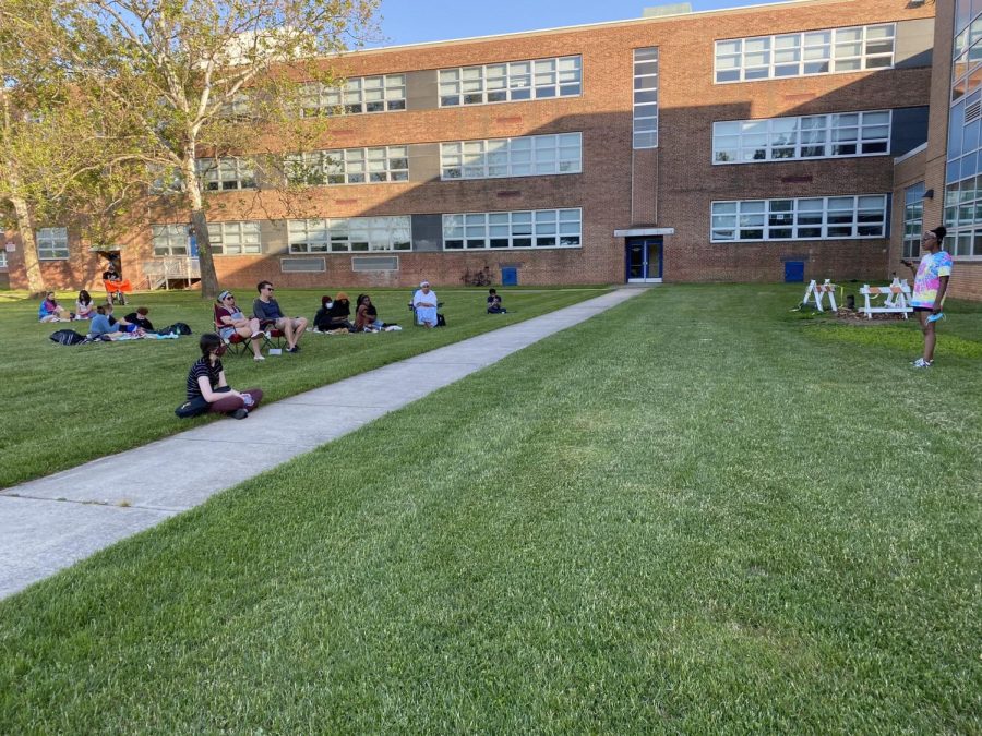 Kenwood students gather on the lawn to listen to their peers performance at Open Mic Night