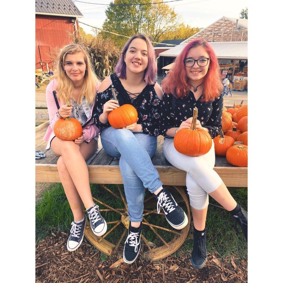 Kenwood+seniors+-Mikayla%2C+Kayla%2C+and+Erica-getting+into+the+spirit+of+Halloween+at+a+local+pumpkin+patch.+