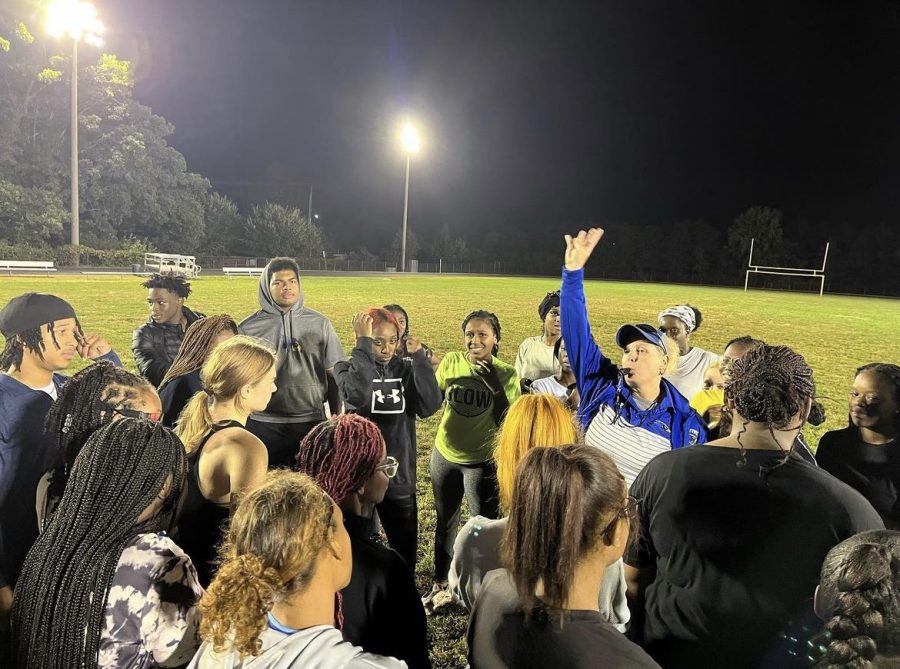 JV football coach Jenn Leaf, who also coaches girls' lacrosse in the Spring, volunteering to coach powderpuff for Homecoming