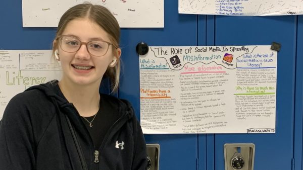 Journalism student Marissa White created a poster to inform her peers about the role social media plays in news literacy. 