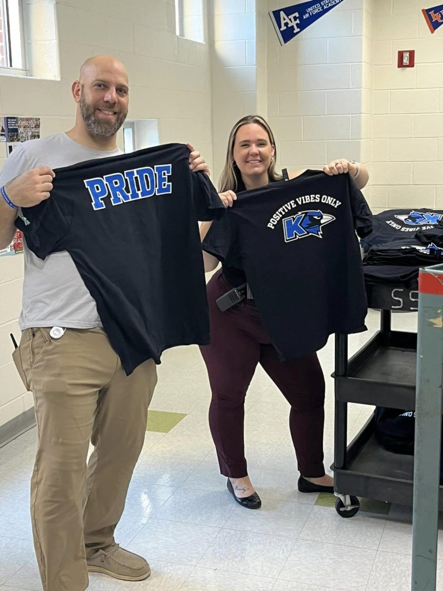 Mr. Goldbeck and Ms. Barton giving out PRIDE shirts for postive first quarter attendance. 