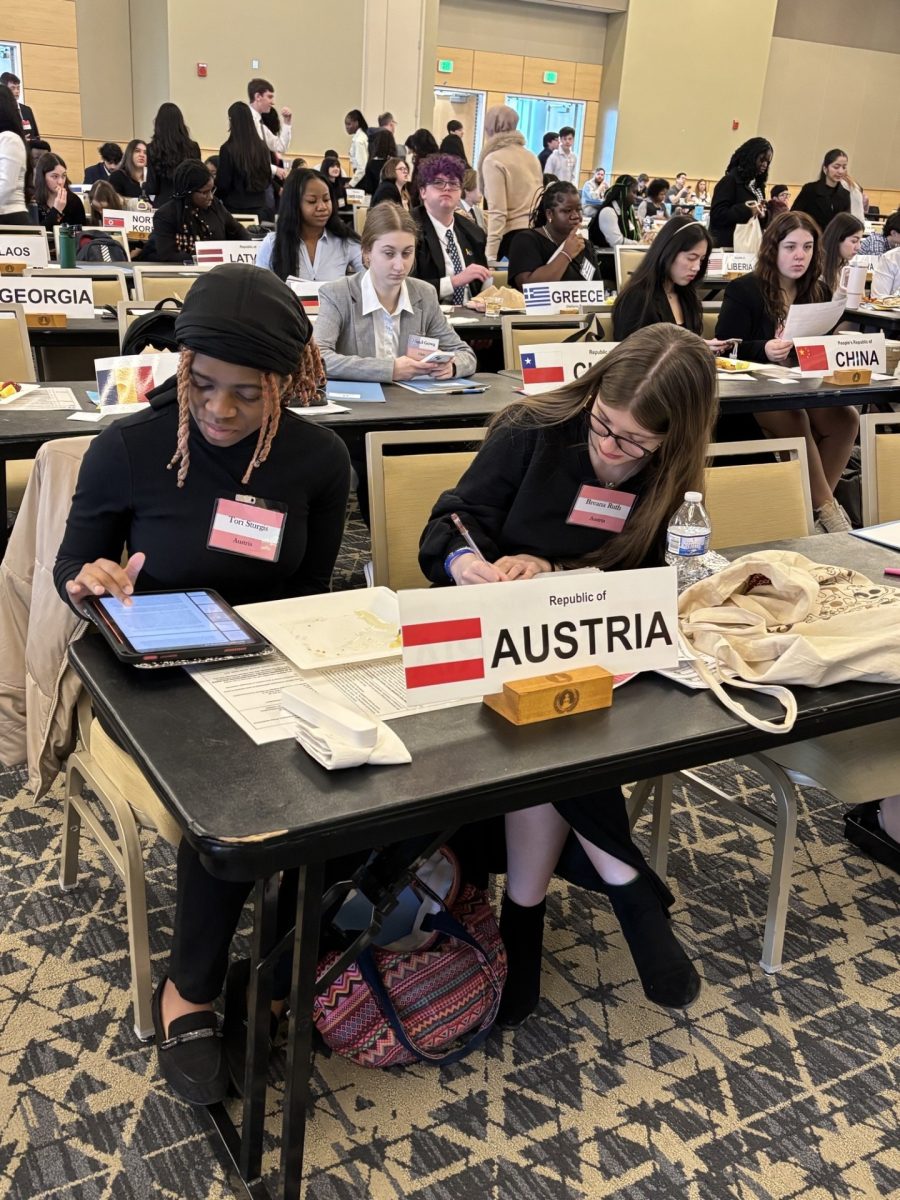 Tori' and Breana working hard to represent Austria's concerns at this year's Model UN Conference at Towson University, 