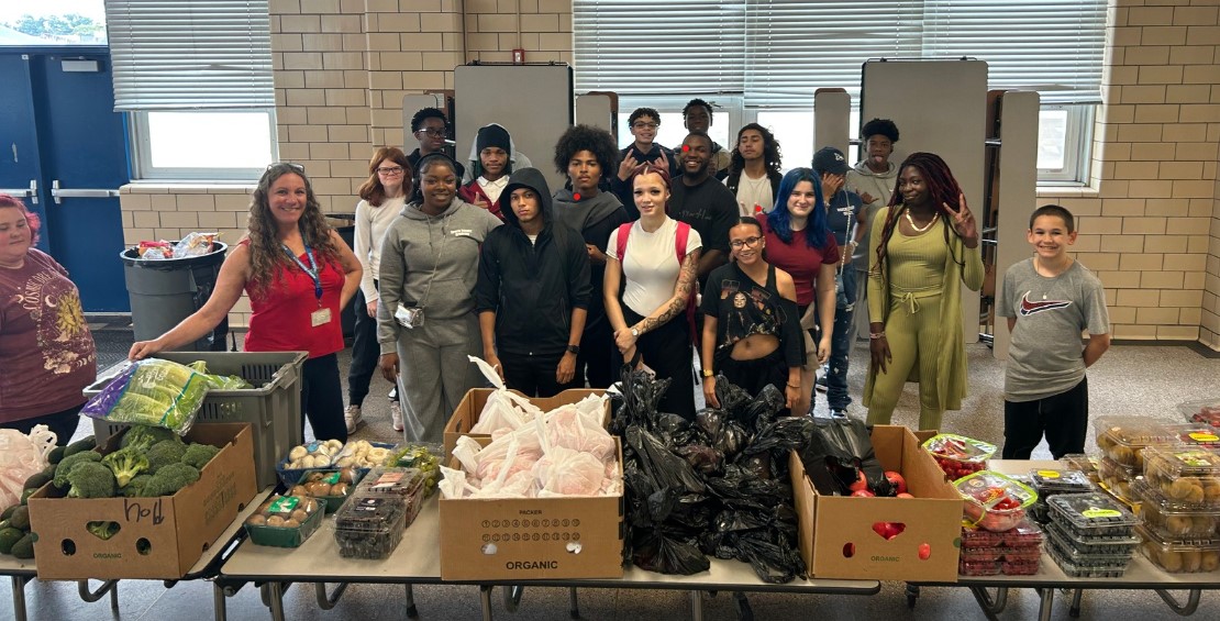 SSA students setting up the Thursday food distribution for October. 